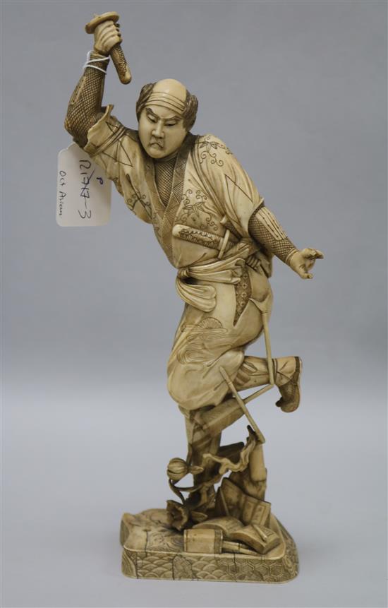 A Japanese ivory of a Samurai, Meiji period, 32.5cm, losses